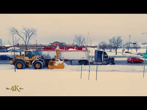 Snowplow Video 36 - Blower shooting snow in truck moving at same pace